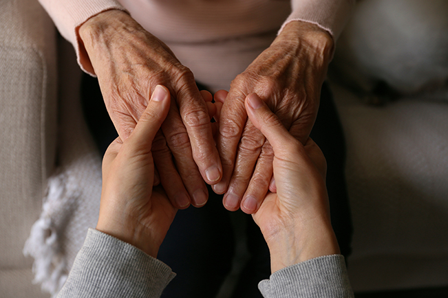 a person holding hands with another person holding them